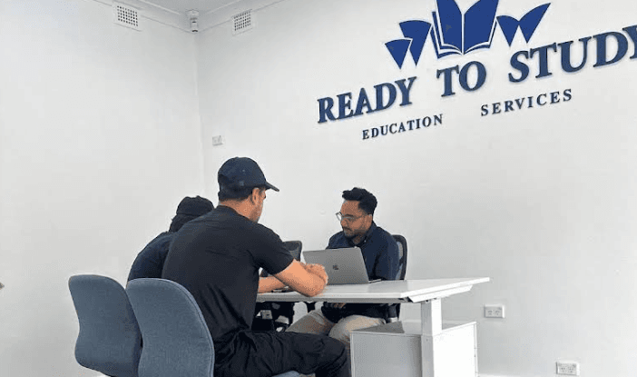 Mashfi Rahman counselling students at the Ready to Study office